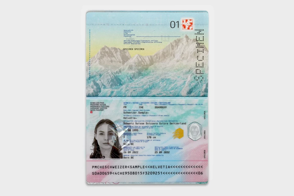 Opened Swiss passport featuring a woman's photograph, mountains, and official text, suitable for travel documentation and identity verification.