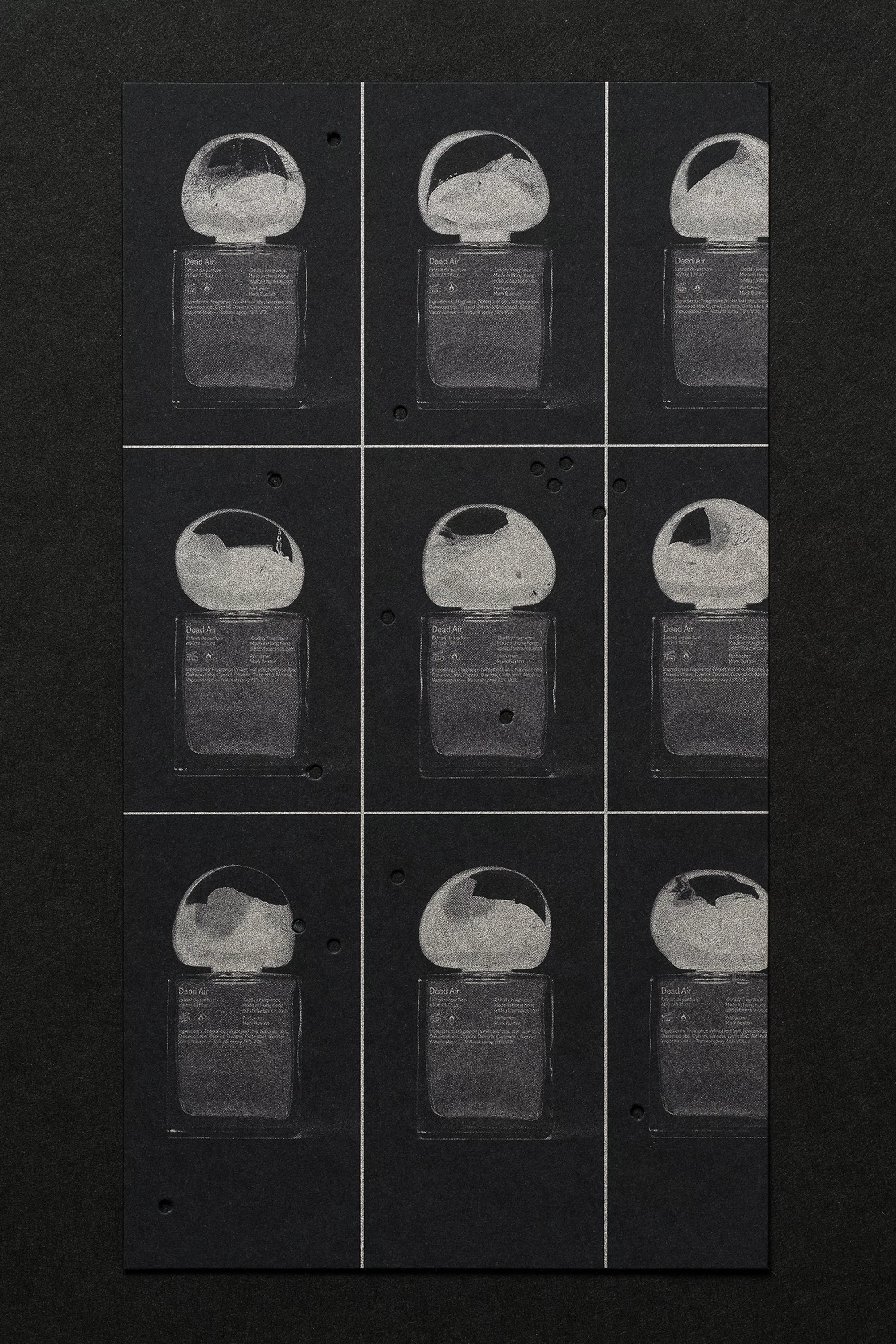 Nine photographic prints on black paper showing studio flash heads with varying light diffusion. Black background, top-down perspective.