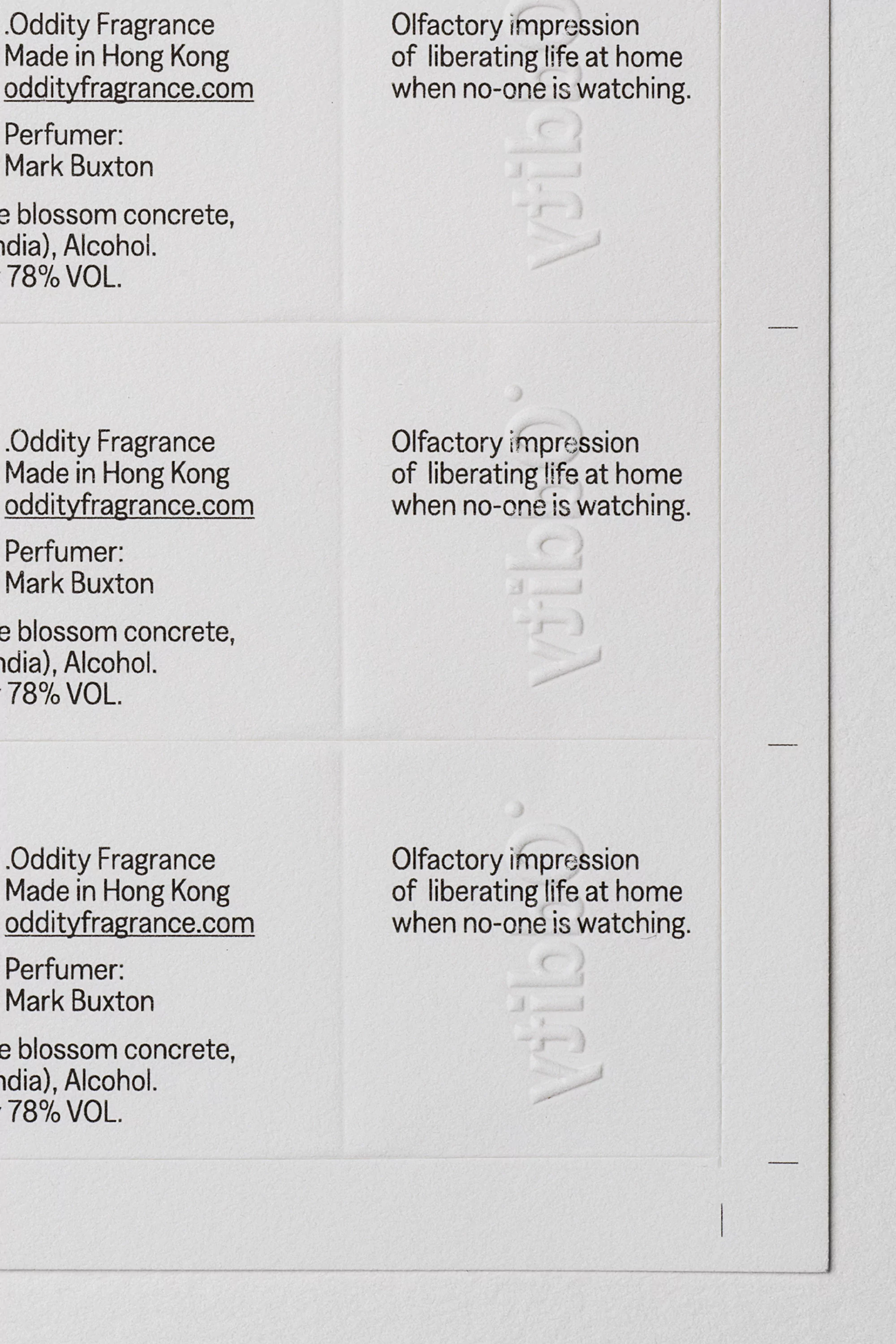 Labels with text for Oddity Fragrance, olfactory impressions, perfume by Mark Buxton, made in Hong Kong, and a website address.