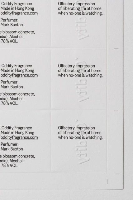 Labels with text for Oddity Fragrance, olfactory impressions, perfume by Mark Buxton, made in Hong Kong, and a website address.