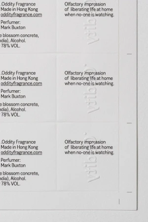 Labels with text for Oddity Fragrance, olfactory impressions, perfume by Mark Buxton, made in Hong Kong, and a website address.