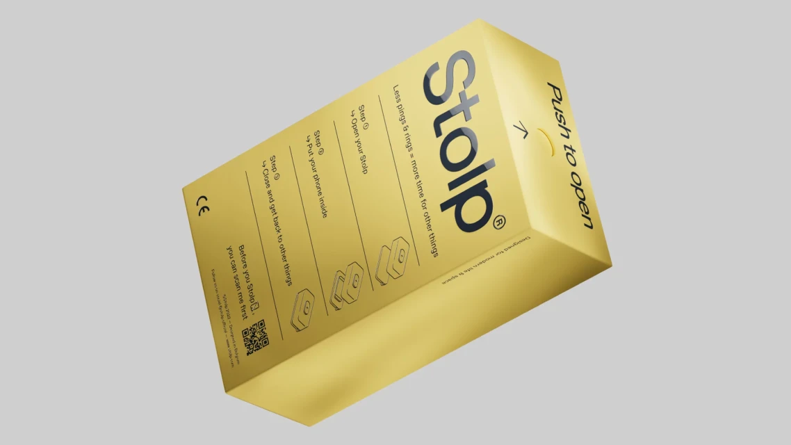 Product shot of a gold Stolp box. Box text reads, 'Push to open,' 'Less pings & rings = more time for other things,' and usage instructions.