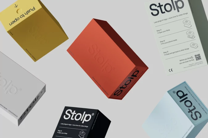 Multiple brightly coloured Stolp product packaging boxes floating against a light grey studio background.
