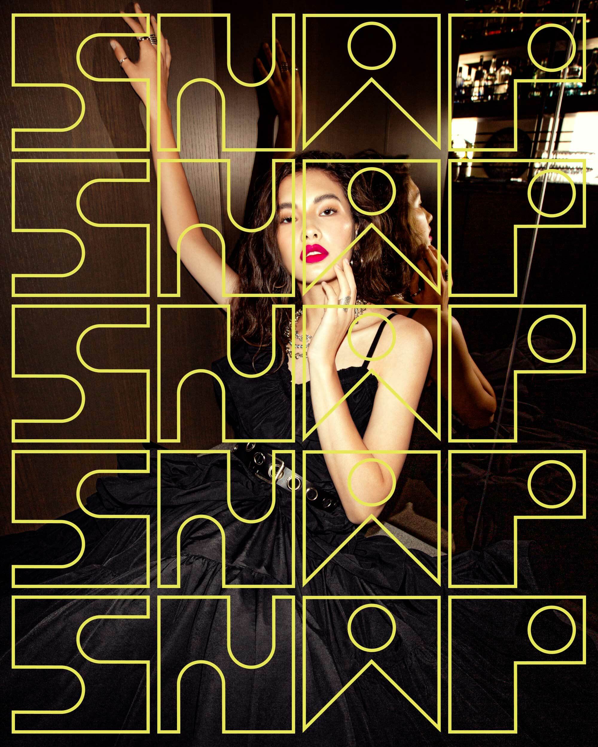 Woman in a black dress with red lipstick, posing against a patterned backdrop, framed by a geometric gold design overlay.