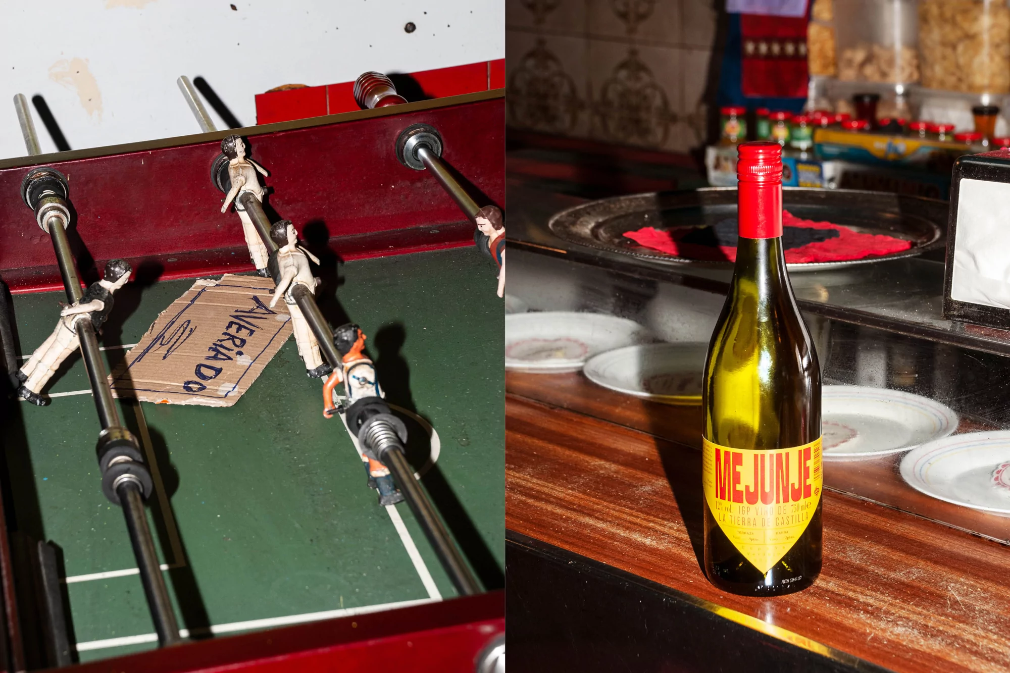 Indoor split-screen view of a foosball table and a wine bottle against a bar backdrop in warm, ambient lighting. 