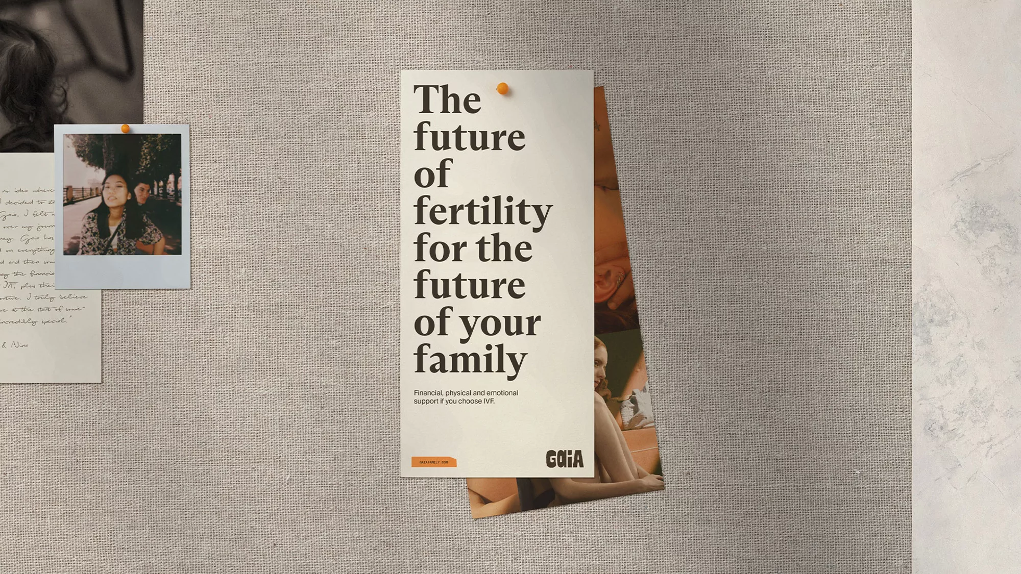 Bulletin board with promotional fertility ad, snapshot of a couple, and handwritten note in natural light.