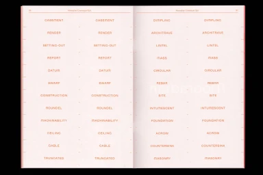Open book pages featuring aligned columns of red architectural terminology printed on pale paper against a dark background