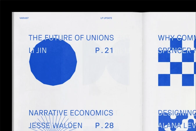 Open magazine spread with stylized text and graphic design in blue and white; article titles, authors and page numbers are visible.