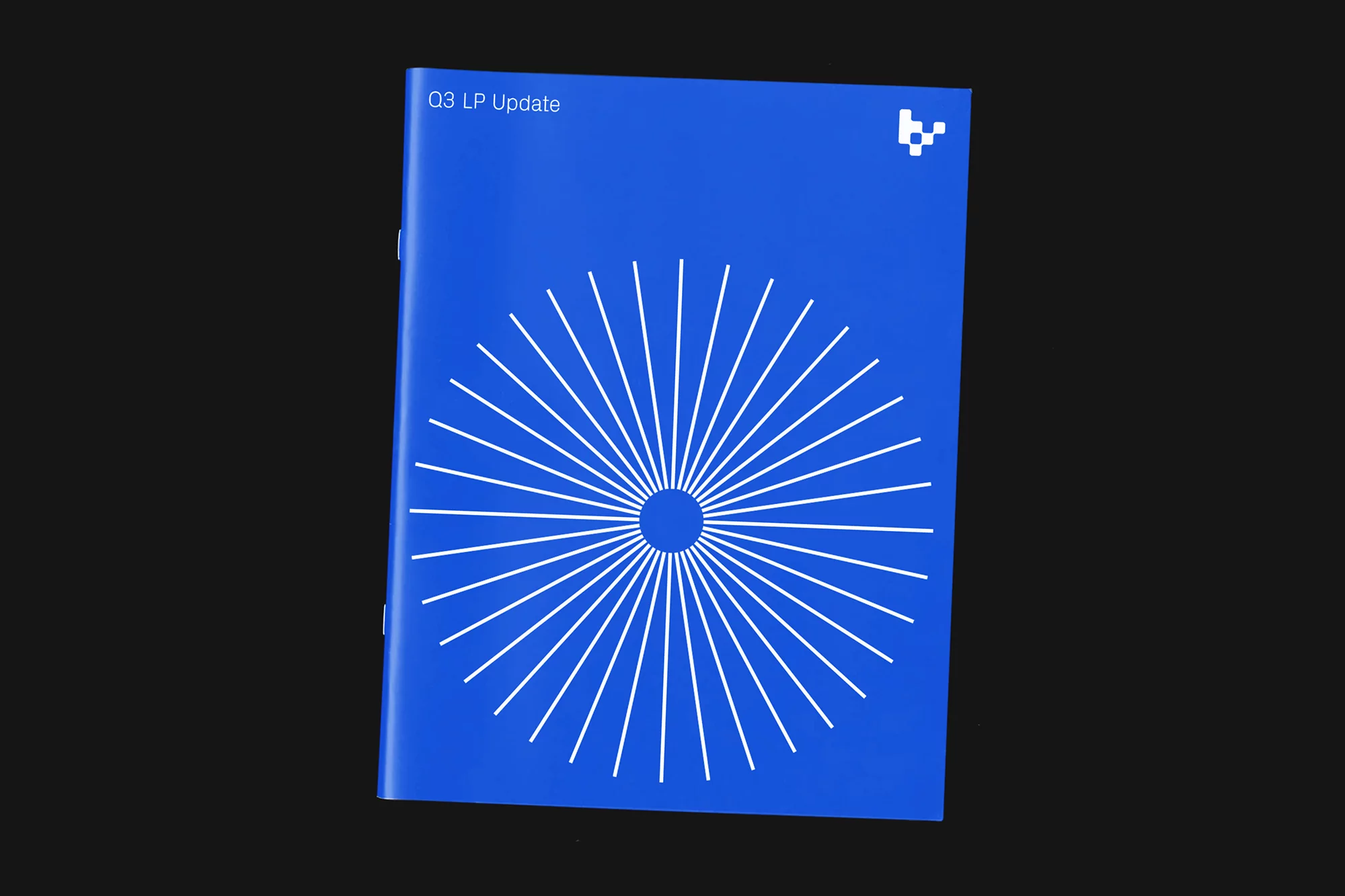 Blue folder features white geometric circle design and the text 'Q3 LP Update' in a studio setting with a black background.