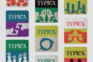 Collection of colourful TYPICA coffee packaging bags featuring bold illustrated graphic designs against a white background.