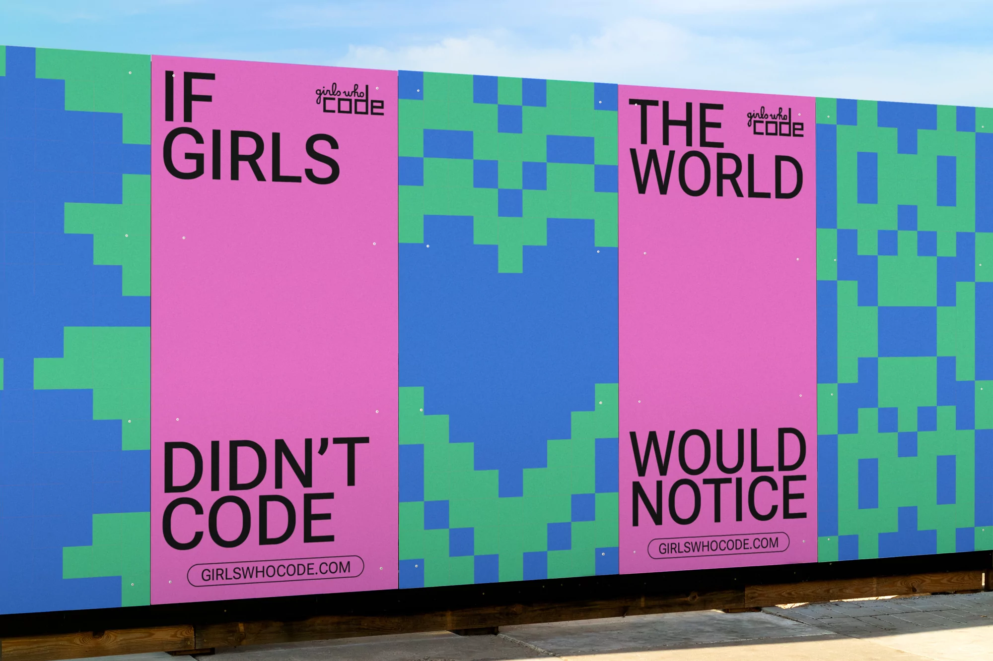 Eye-level shot of a colorful sign with the words 'If Girls Didn't Code The World Would Notice' on a patterned background.