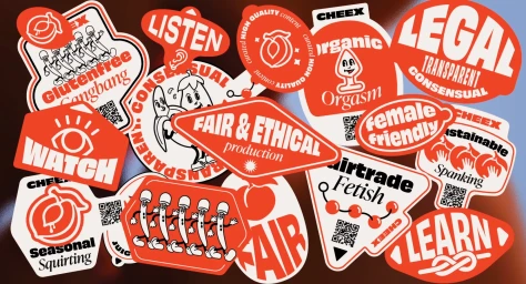 Collection of various red and white die-cut brand stickers with playful typography and illustrations on a dark surface.