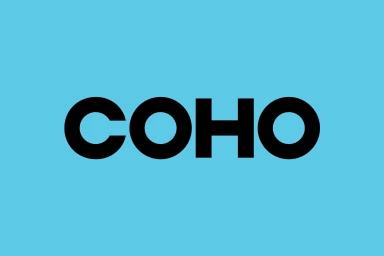 Bold black typography spelling COHO centered on a bright cyan blue background