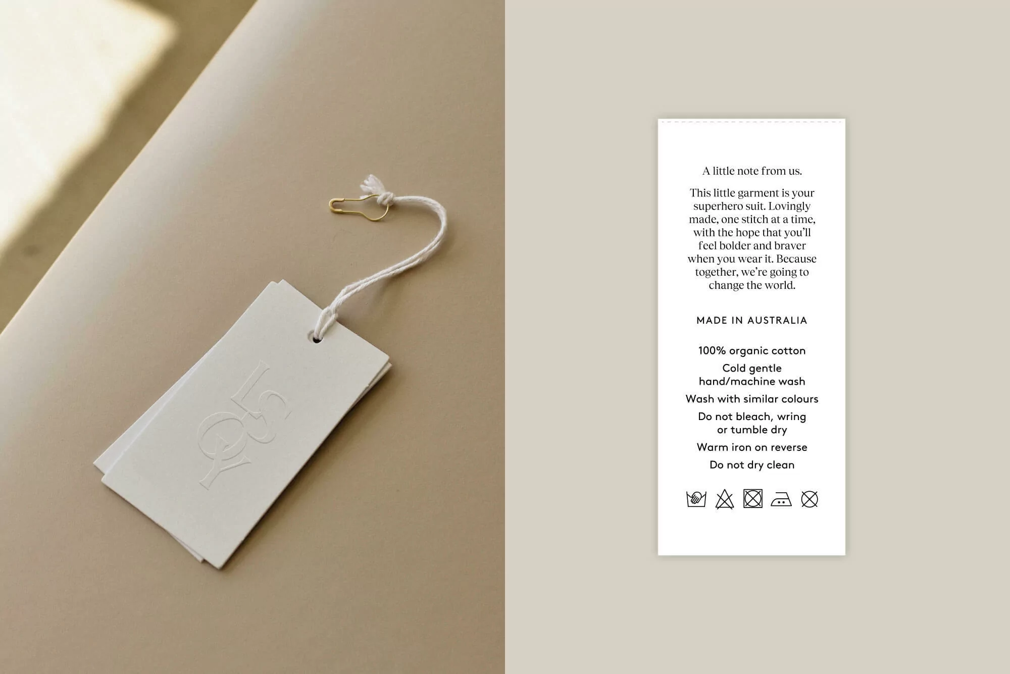 Close-up of a clothing tag with a safety pin and care instructions against a neutral background, highlighting garment details.