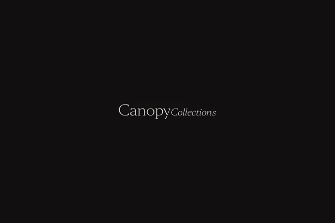 Elegant typography featuring the brand name 'Canopy Collections' against a dark backdrop, creating a sophisticated and minimalist aesthetic.