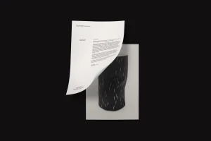 Curved letterhead featuring Canopy Collections branding displayed over a photograph of a black patterned ceramic vessel.