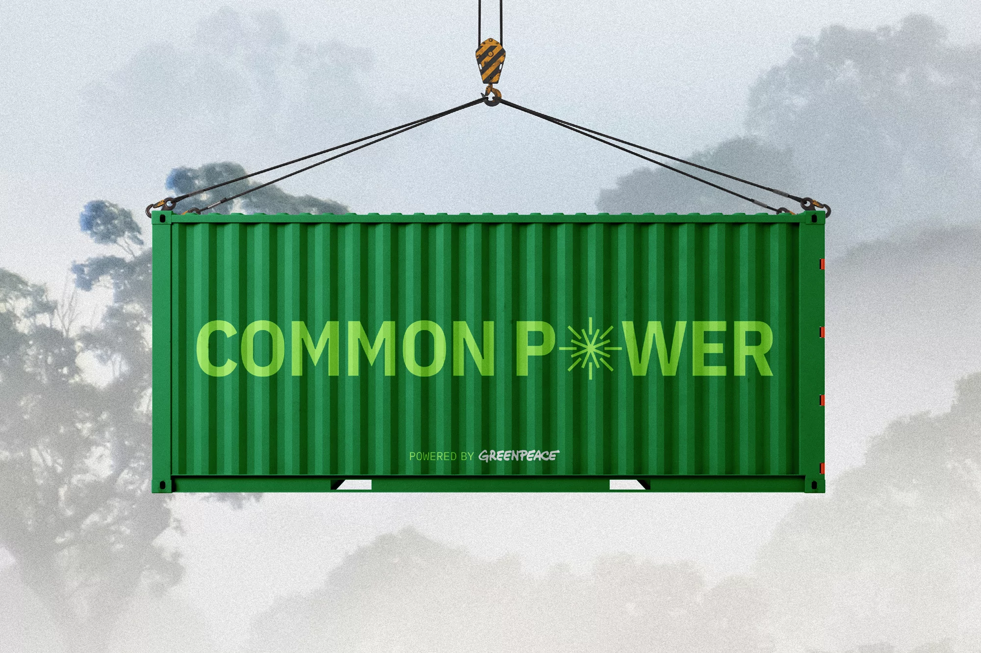 Green shipping container suspended by crane against a cloudy sky with trees, featuring text "Common Power Powered by Greenpeace".
