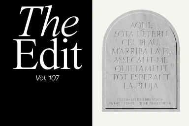 Split composition showing bold white serif typography on black next to an engraved stone arch monument with Catalan text.