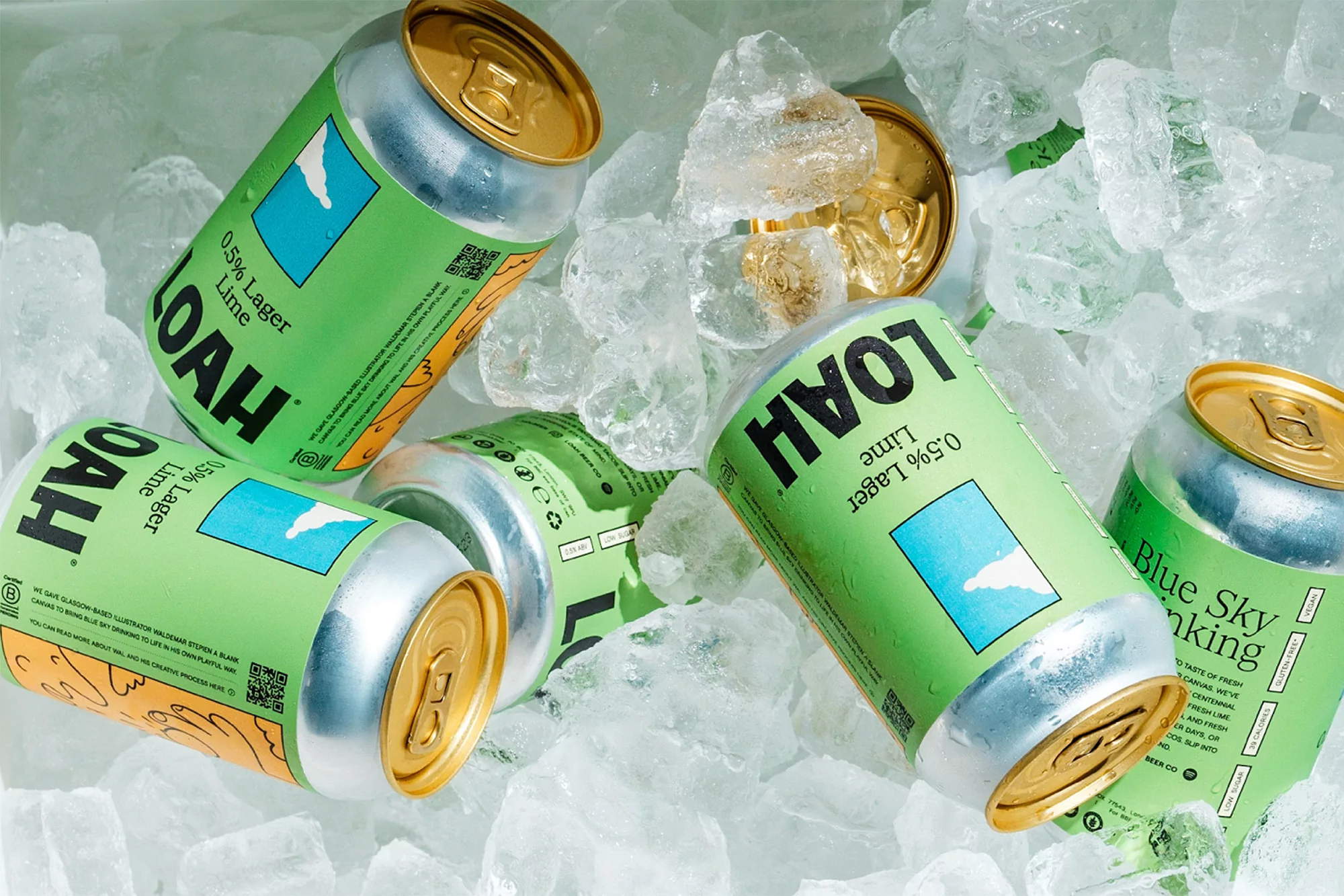 Cans of lime lager are arranged on a bed of clear ice, creating a refreshing and visually appealing beverage advertisement.