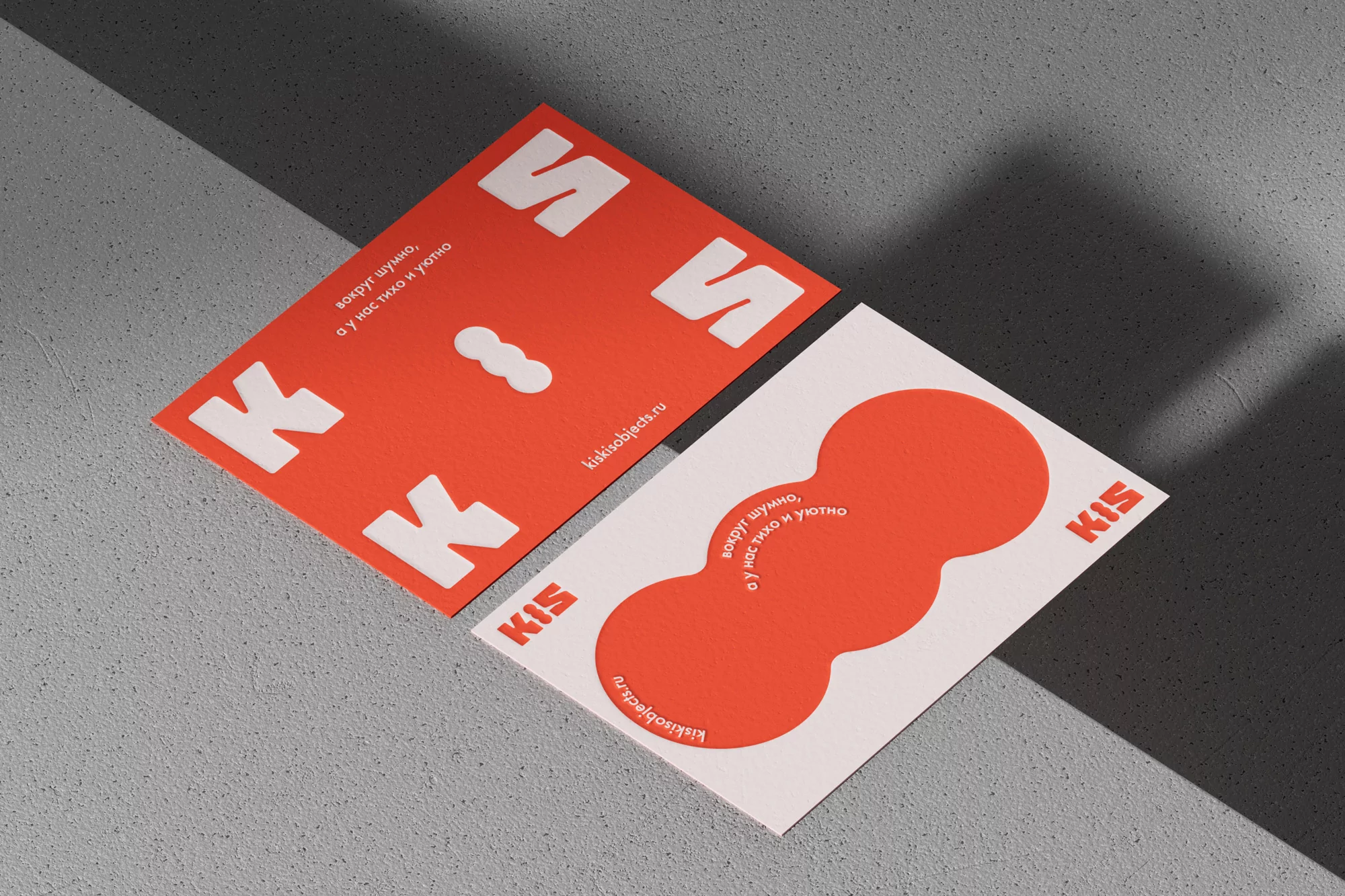 Two KIS-branded cards showcasing modern graphic design, featuring a bright red and white color scheme with bold typography and geometric shapes.