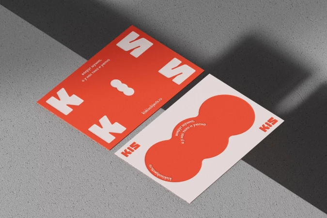 Two KIS-branded cards showcasing modern graphic design, featuring a bright red and white color scheme with bold typography and geometric shapes.