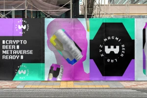 Vibrant construction hoarding featuring WAGMI Beer branding, purple silhouettes, beer cans, and pixelated crypto typography on a street.
