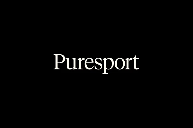 White serif brand typography spelling Puresport centered on a solid black background.
