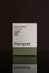 Puresport Female Balance supplement product box centered on a dark reflective surface against a dark background