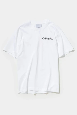 White t-shirt with the word 'Depict' on the upper right side of the shirt on a white seamless background in a studio setting.