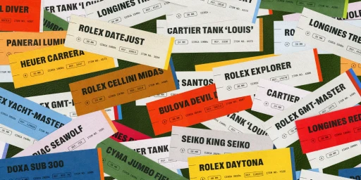 An arrangement of colorful vintage watch specification tags and labels scattered over a green leather surface.