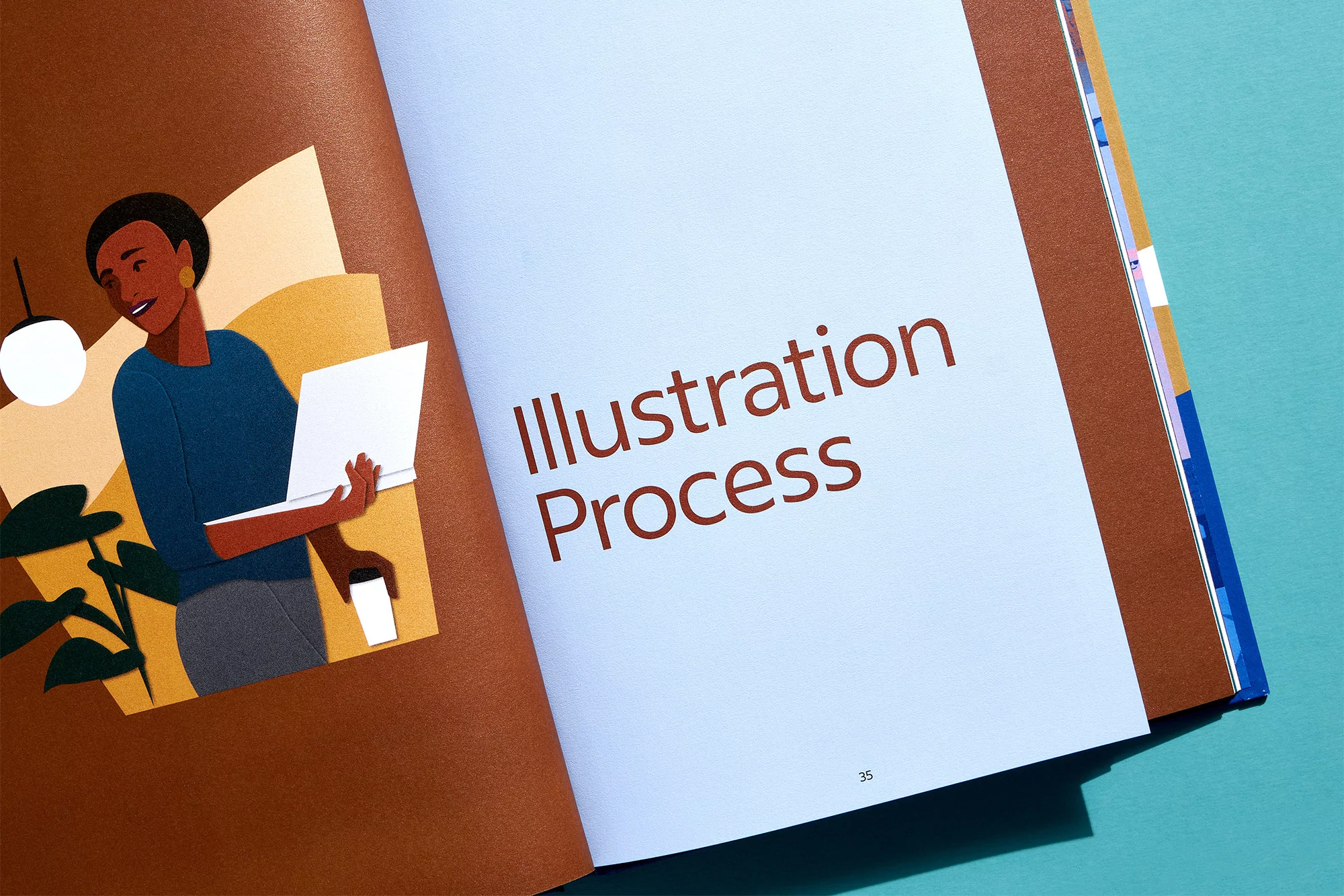 Illustration in an open book shows a Black woman working on a laptop, next to a potted plant and table lamp, against a brown background.