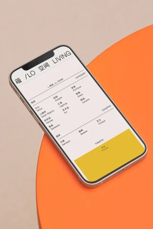 Smartphone displays a design app on an orange surface, featuring a white screen with categorized furniture options and text.