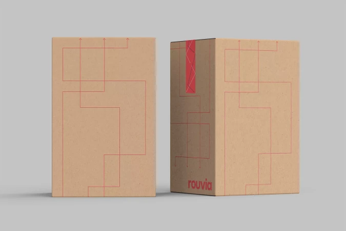 Two cardboard boxes with red line art and a 'rouvia' logo are set against a neutral gray background, showcasing product packaging design.