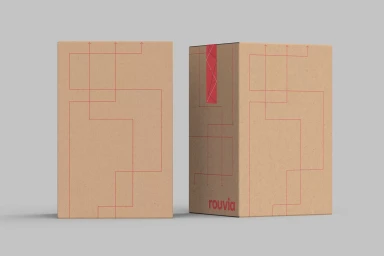Two cardboard product boxes featuring red line graphics and logo typography against a neutral grey background