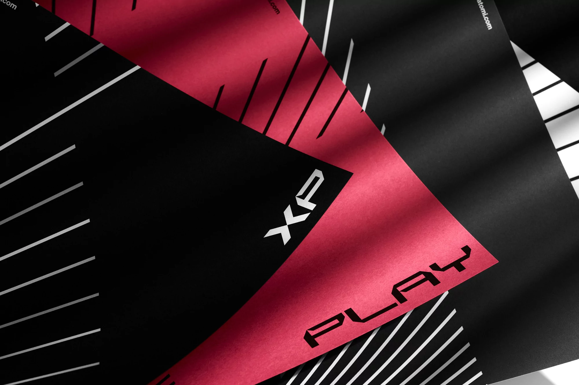 Graphic design featuring angled black and red cards with white text and lines, styled with shadows for a dynamic, modern presentation.