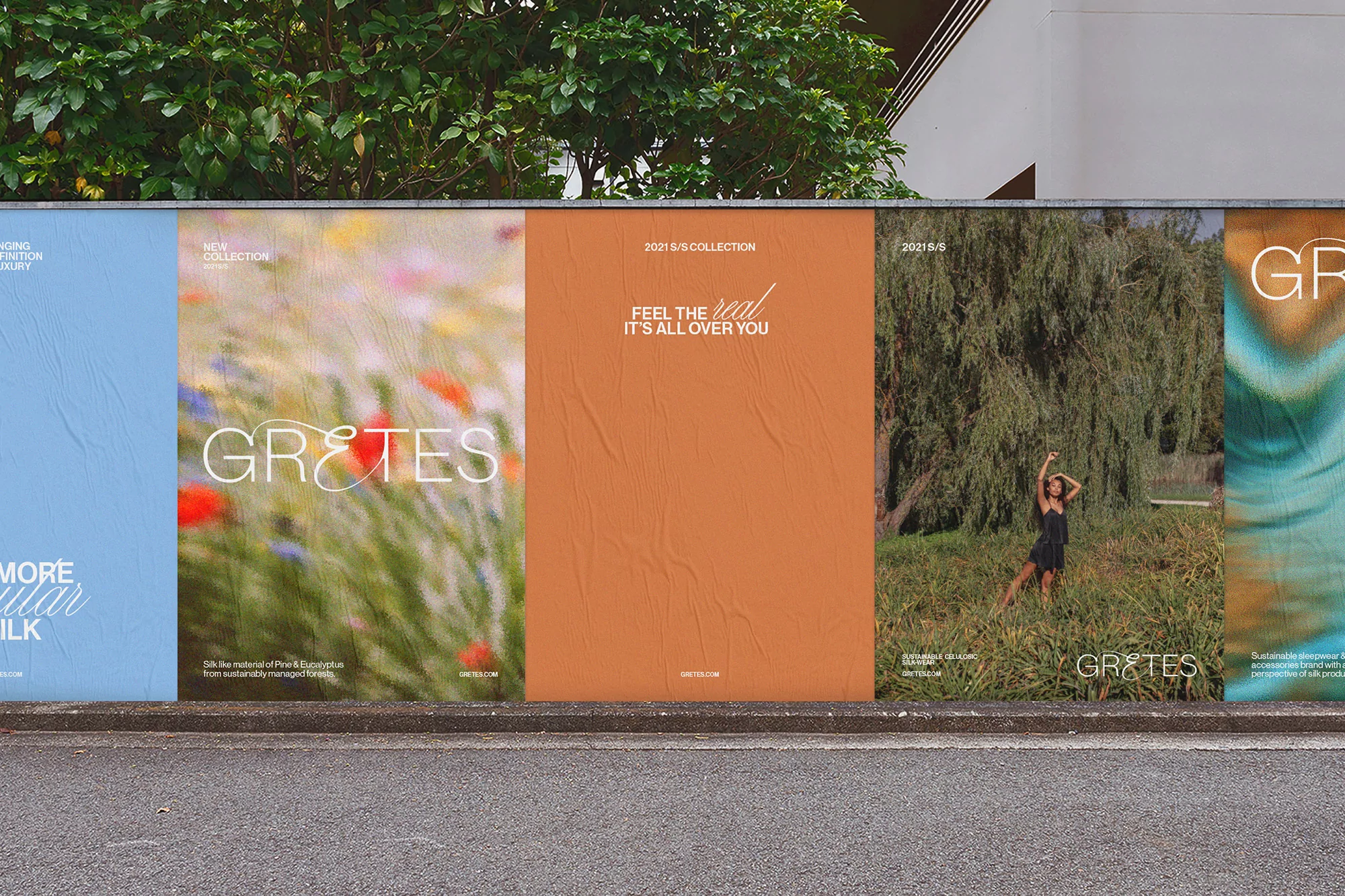 Large outdoor advertising posters for fashion brand 'GRETES' showcase diverse nature-themed designs and brand logos along a city street.