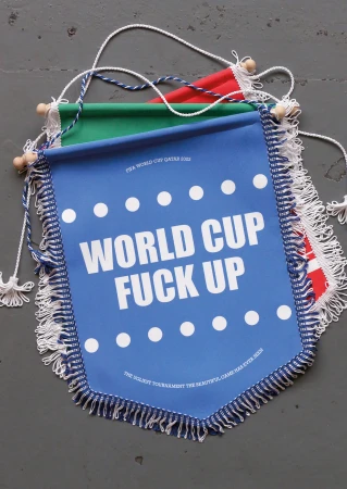 Three pennant banners in red, green, and blue with humorous white text and fringe details, hanging against a grey surface.