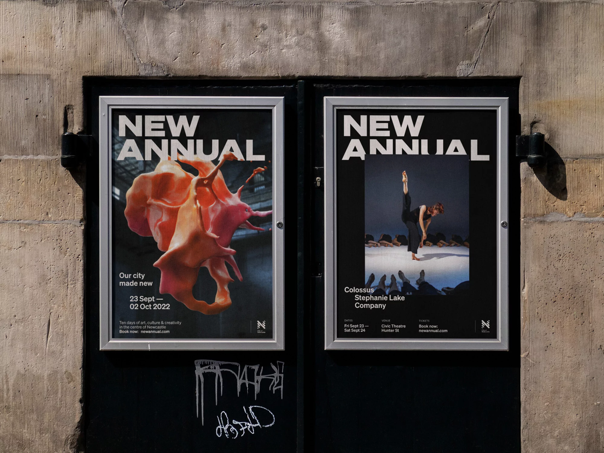Two posters with an abstract organic shape and a dancer in black and white on an exterior stone wall, advertising 'New Annual'.
