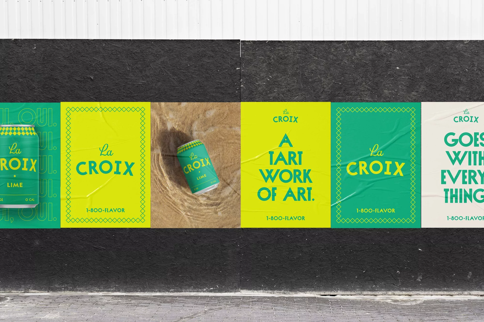 Outdoor advertising featuring cans of La Croix lime sparkling water on a black brick wall with peeling posters in green and yellow tones.