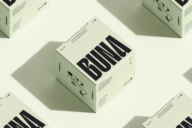 Eye-level shot of BUNA-branded white cubes against a pale backdrop with soft shadows, creating a clean and modern product display.