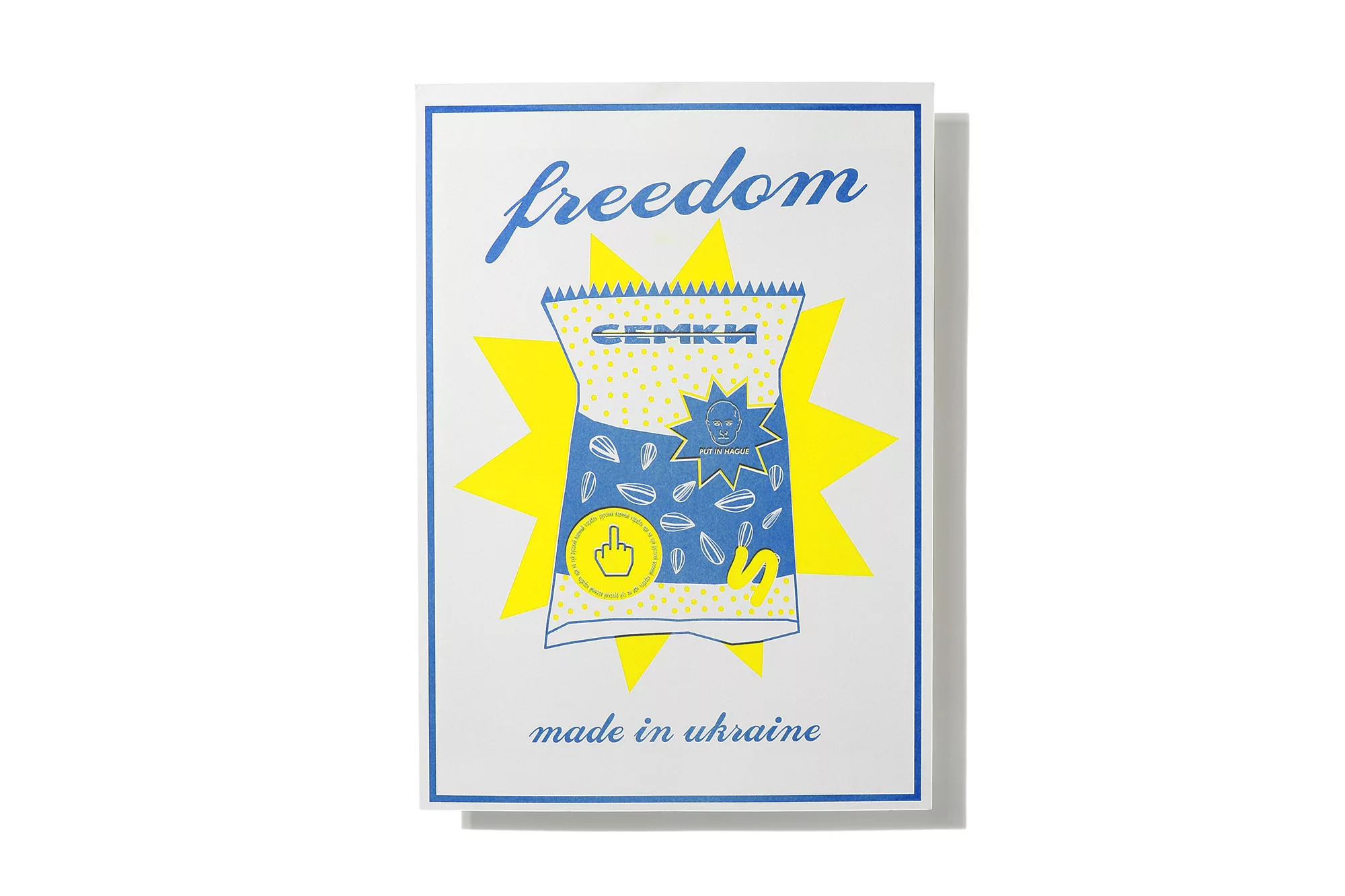 Illustrated poster featuring a snack bag, text 'freedom,' and 'made in Ukraine' with a starburst background on a white backdrop.