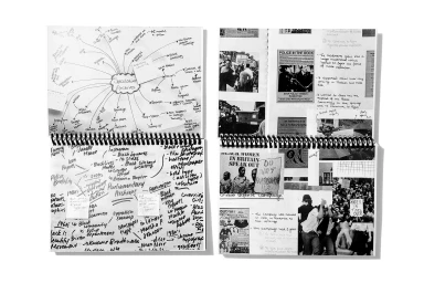 Two spiral-bound notebooks featuring handwritten mind maps, collaged archival newspaper clippings, and protest photography.