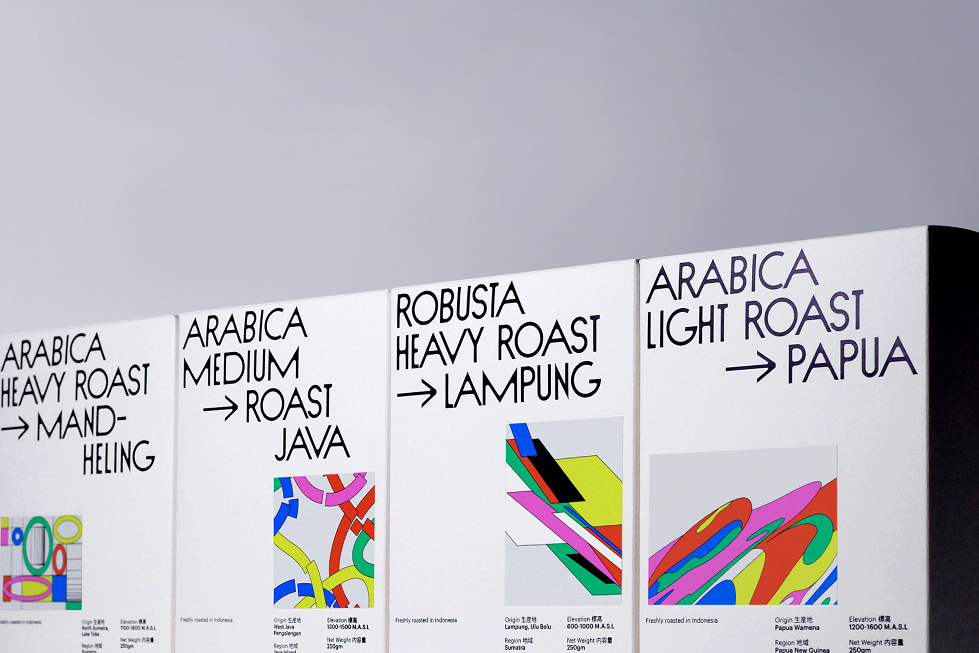 Four white coffee bags showcasing abstract designs and roast types like Arabica Heavy Roast and Robusta Heavy Roast, arranged closely together.