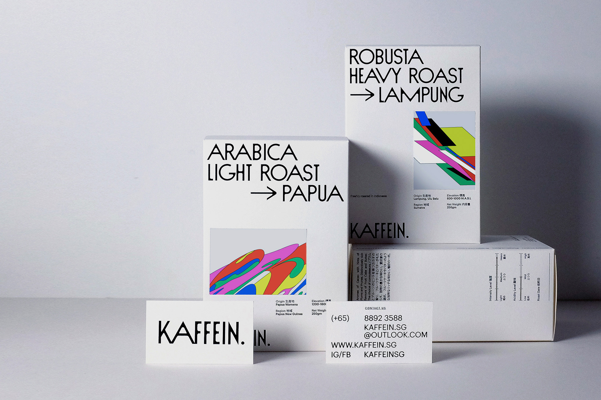 Kaffein brand of Arabica light roast and Robusta heavy roast coffee beans in white cardboard boxes against white background.