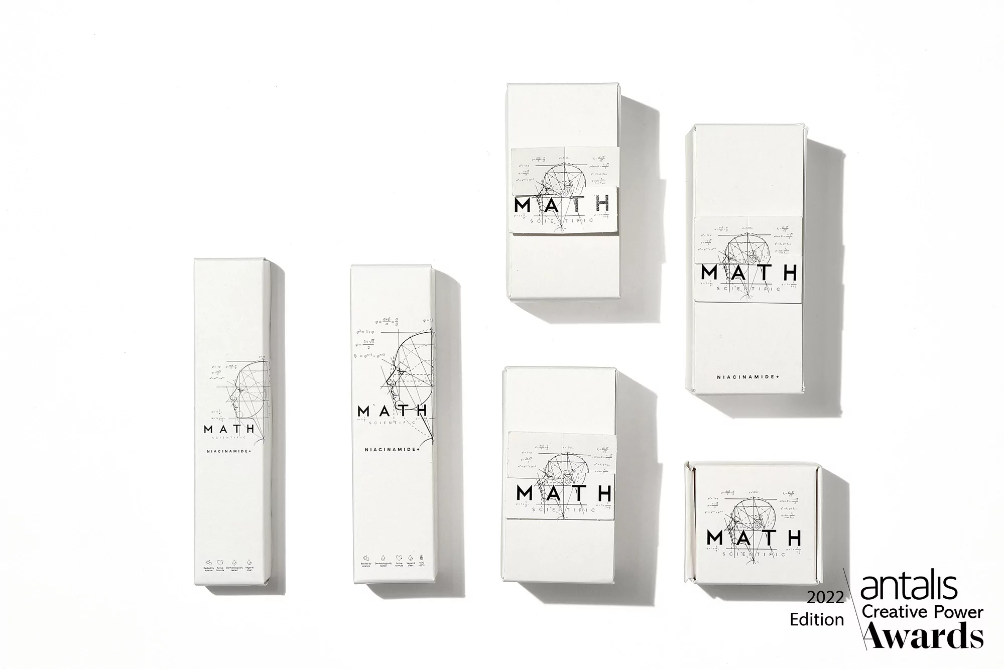Product packaging featuring a white box with math-themed line drawings and lettering. Clean aesthetic on a white background.