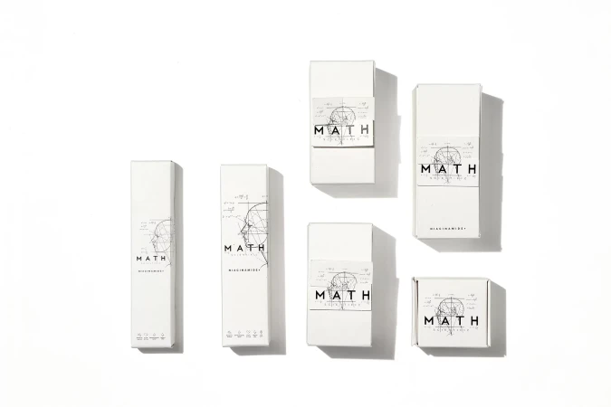 Top-down view of white rectangular and square product packaging boxes arranged on a clean white background