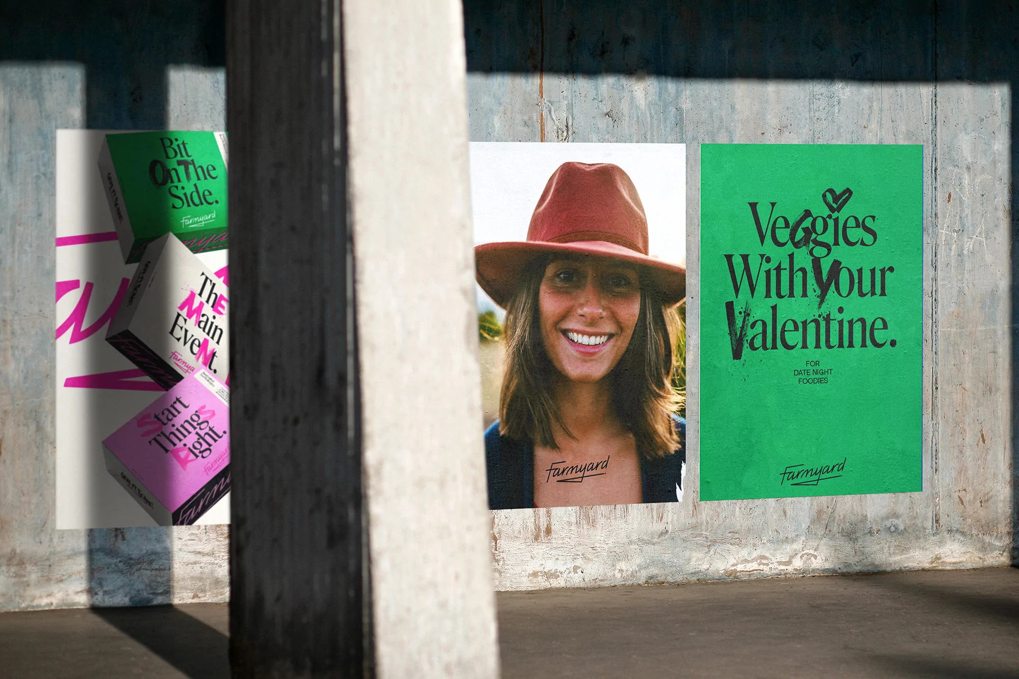 Advertisements are displayed on a textured concrete wall featuring a smiling woman and food-themed ads for Farmyard.