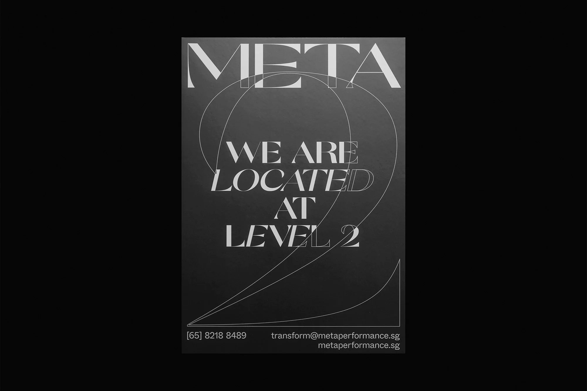 Promotional poster featuring large text 'META' above smaller text 'WE ARE LOCATED AT LEVEL 2' on a gray gradient background.