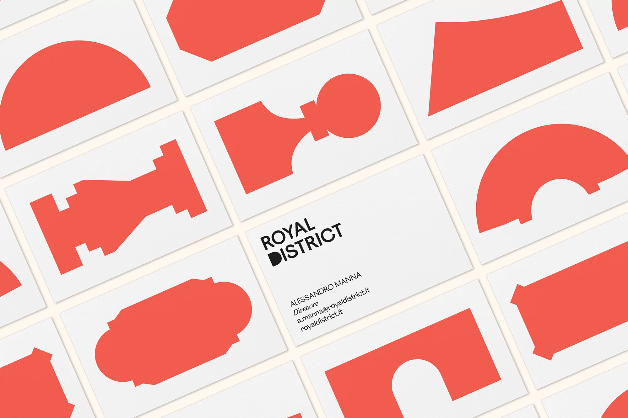 Geometric business cards for Royal District, featuring bold coral shapes and modern typography, set against a clean, bright background.