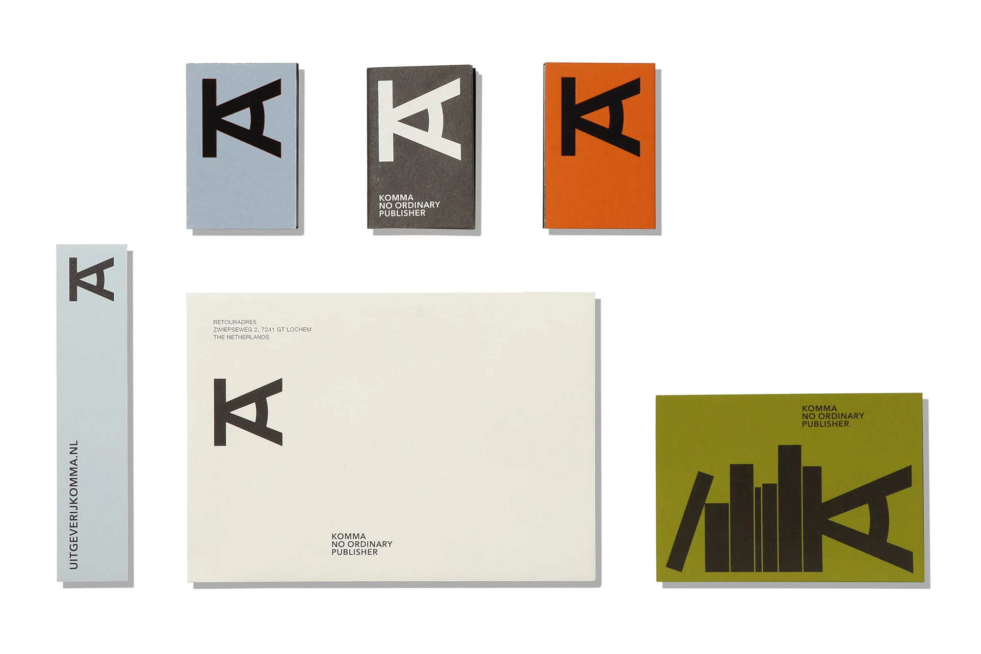 Promotional image featuring Komma No Ordinary Publisher, showcasing business cards, a letterhead, and a bookmark against a white background.